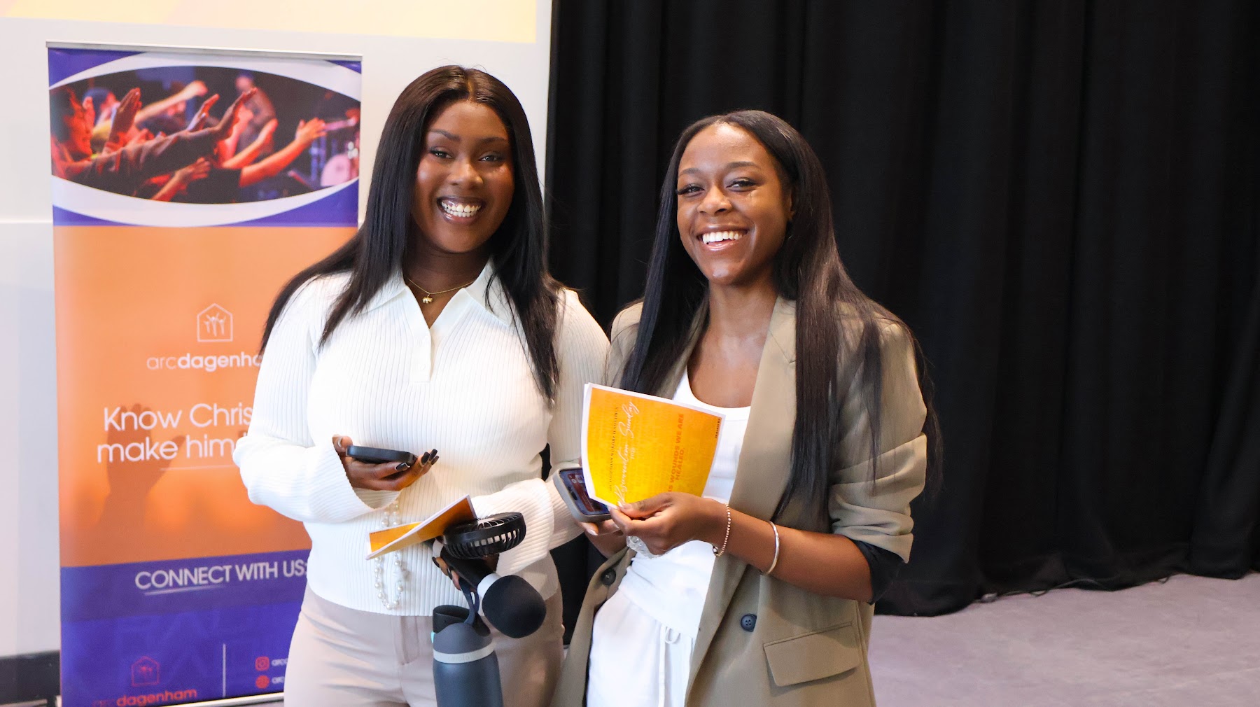 Two members of the ARC Dagenham welcome team smiling